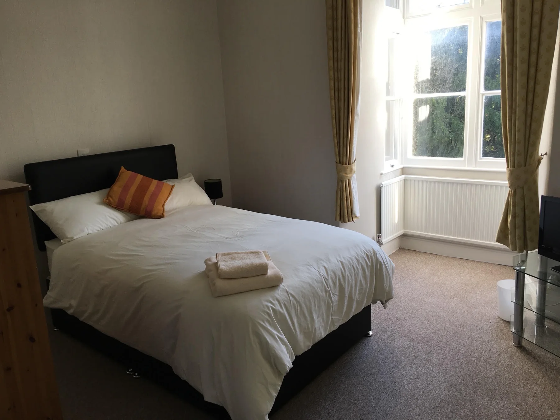 Furnished bedroom with towels provided
